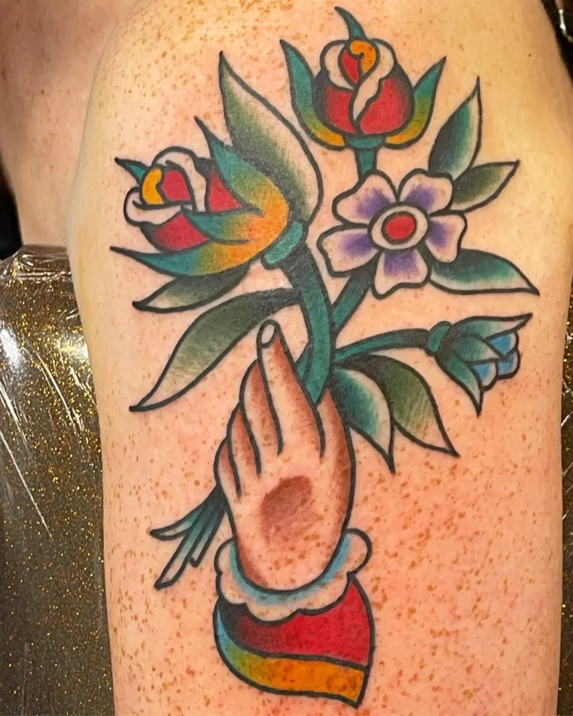 American traditional flower tattoo on leg done at Good Company Tattoo in San Diego.